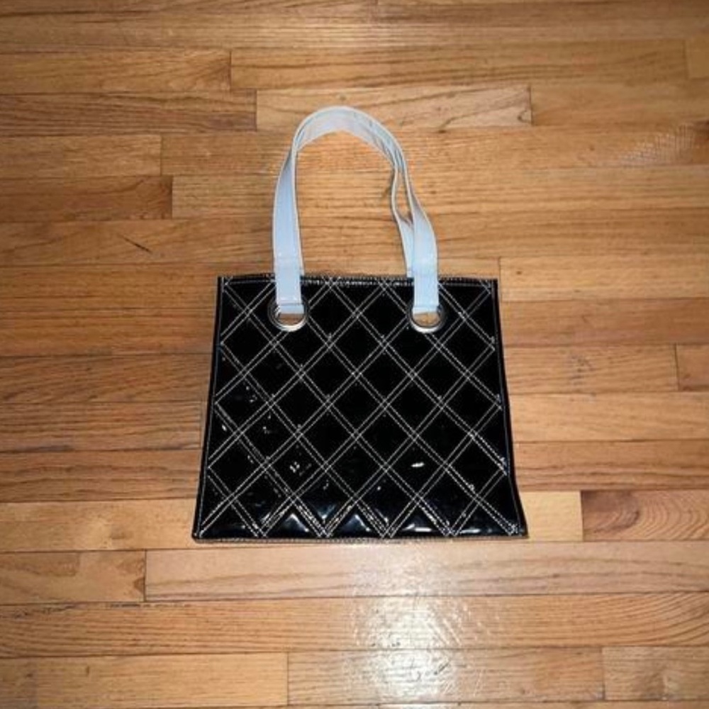 Black vinyl cross stitched Essence of Beauty bag
